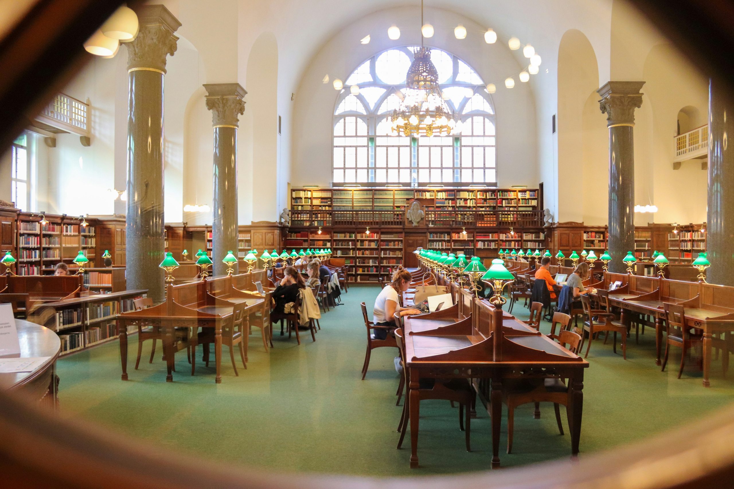 A photo of a college library with students studying.